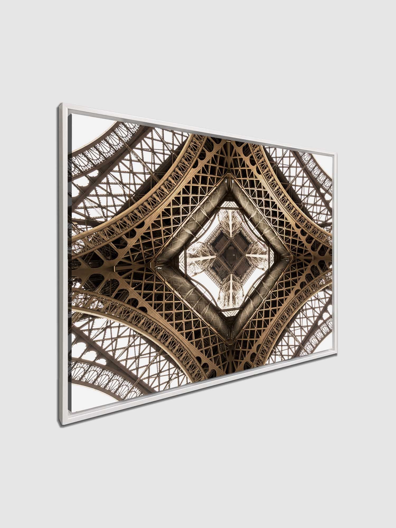 A canvas print featuring a close-up geometric pattern of the Eiffel Tower's structure.