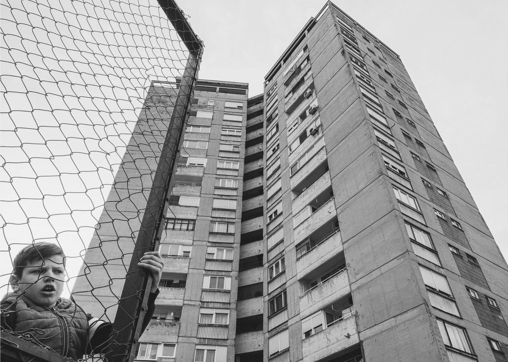 Artwork- The boy behind the fence-20X16inches-In Black Floating Frame
